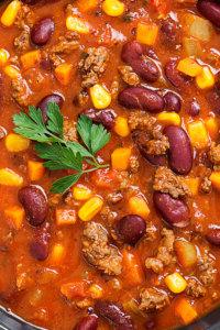 Traditional mexican dish chili con carne with minced meat and re